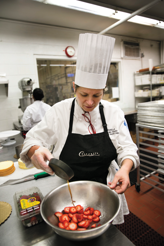 A pastry chef mixes up the ingredients for strawberry shortcake. 