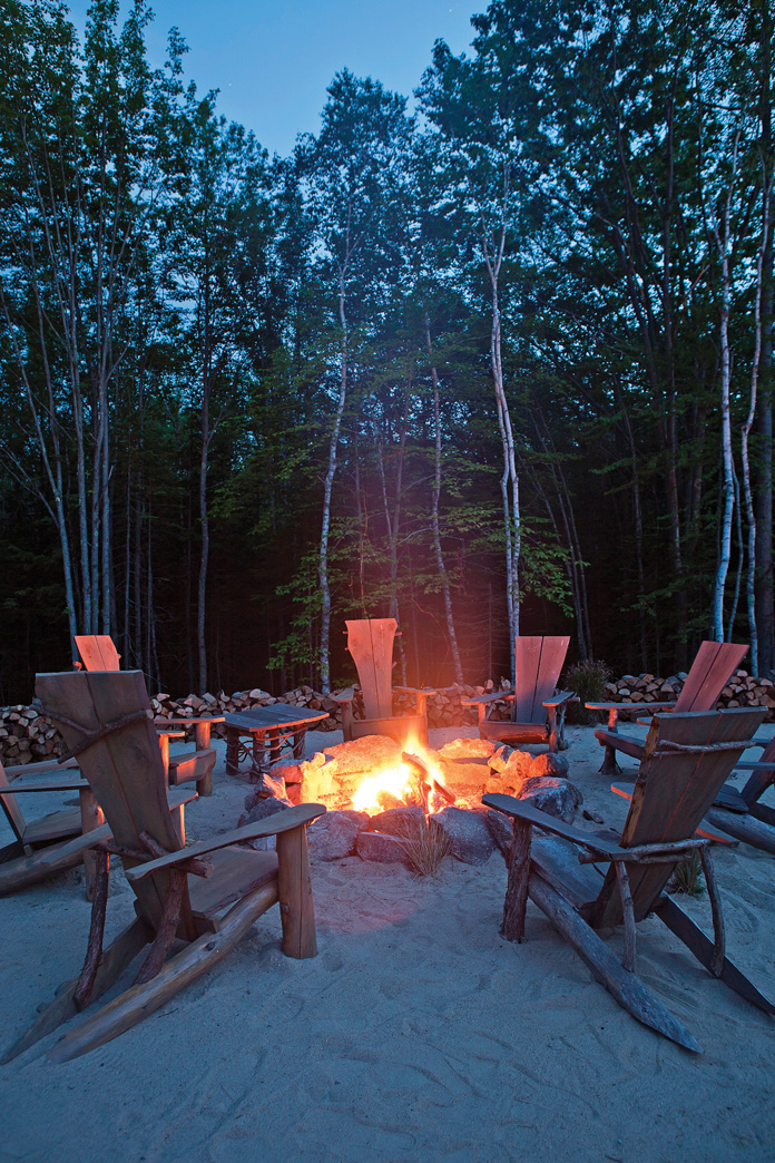 A cozy bonfire and lounge area at Hidden Pond