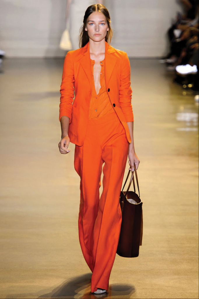 Orange is the new black for fashionistas and designers. An Altuzarra suit at New York Fashion Week is shown. 