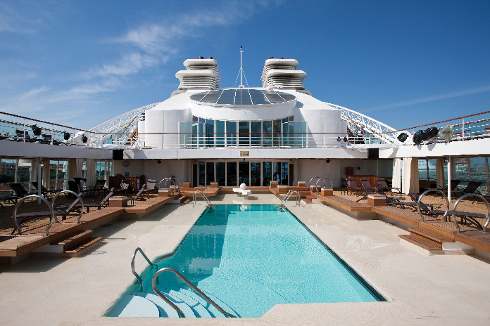Relax poolside on one of 10 decks of the intimate 225-suite Seabourn Quest during your days at sea.