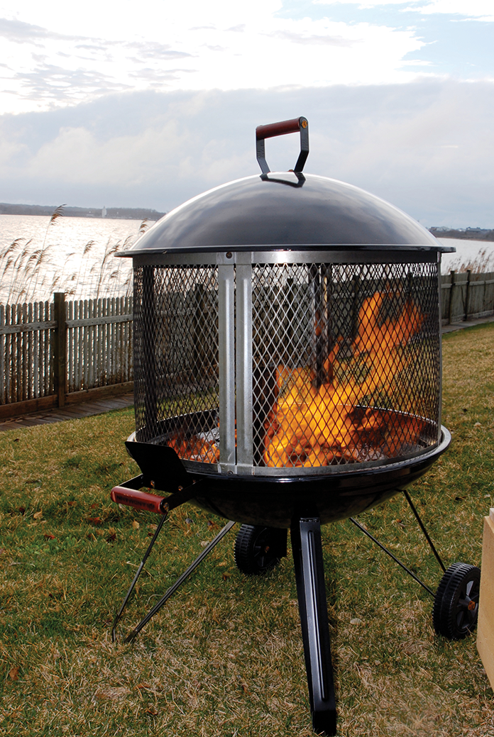 ON THE GO The popular, portable Landman USA Fire Pit on Wheels also functions as a grill and is equipped with grates for wood and cooking, The Greatest Blaze & Co., $195, greatestblaze.com