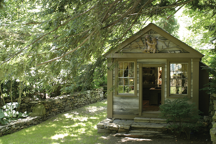 A small library sits opposite the pool at Trapp’s West Cornwall property.