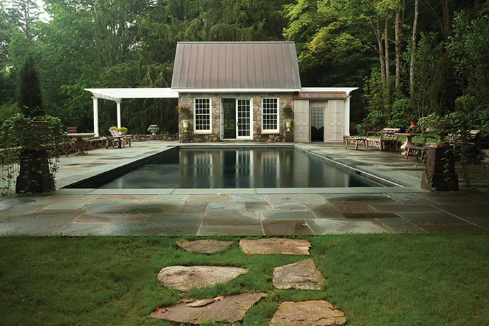 A recent project Trapp completed in Sharon, CT features a gunite pool with a bluestone terrace and a stone-faced poolhouse.