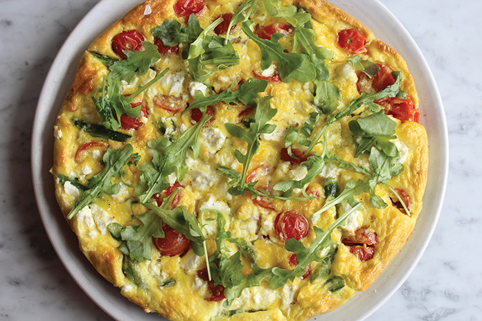 “I love this frittata because it has my favorite spring vegetable: asparagus. They’re in season only for a little while,” says Peña. “The feta adds a salty bite and the arugula on top freshens up the whole dish.”