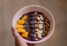 An acai bowl in a person's hand