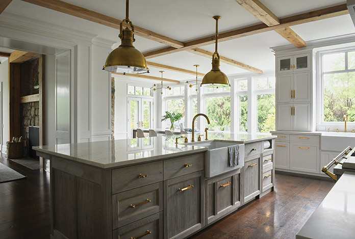 A modern farmhouse design incorporates natural and contemporary elements. Brass hardware and lighting are trending in a fresh, new way.