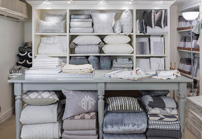 the shelves of the New Canaan shop are abundantly stocked with luxurious linens and accessories for every room.