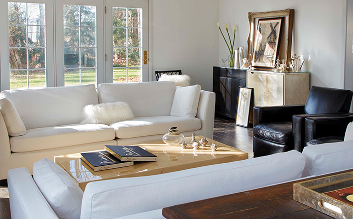 A modern living room with white couch.