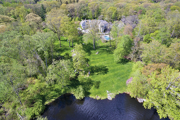 Nestled on 4.4 beautifully landscaped acres, this property ensures privacy.