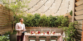 Image of David Burtka outside with a table