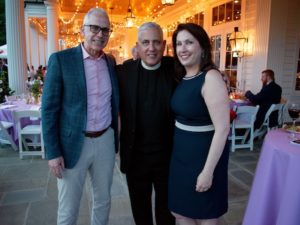 Image of John and Francesca LaGumina, and Fr. Thomas Patrillo (center)