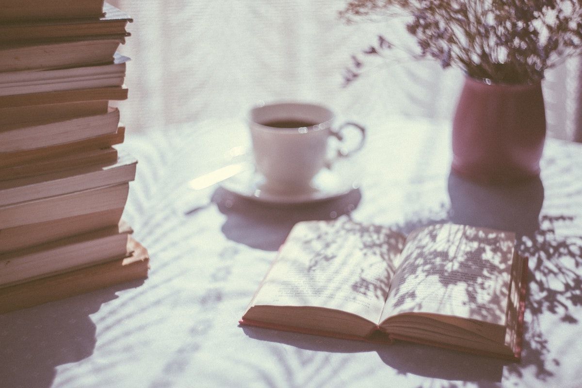 Book on table with coffee