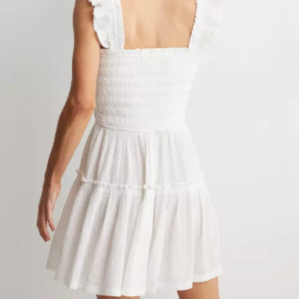 Back of white mini dress with tank style sleeves