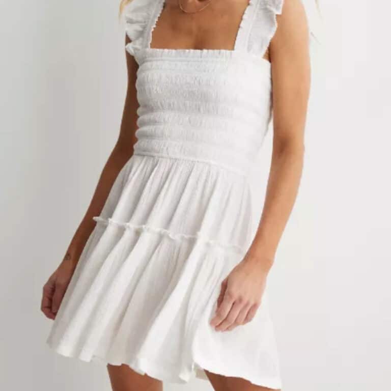 short and white shoulder dress on model
