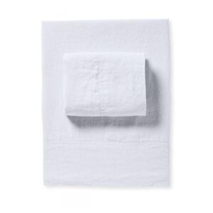 folded white linen sheet set